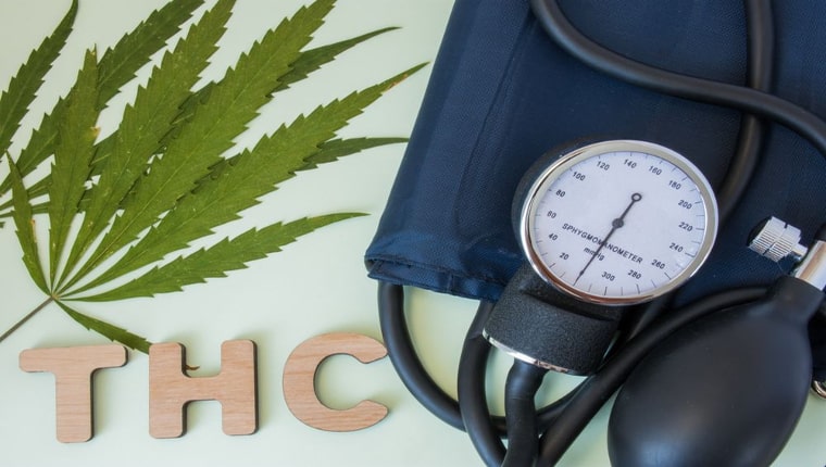 THC leaf and blood pressure cuff